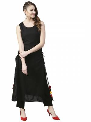 Grab This Pretty Readymade Designer Kurti In Black Color Fabricated On Rayon. It Has Very Pretty Side Pattern With Tassels. Buy This Lovely Kurti Now.
