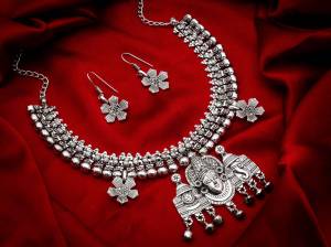 Give An Enhanced Look To Your Personality By Pairing Up This Beautiful Necklace Set With Your Ethnic Attire. This Pretty Set Is In Silver Color Which Can Be Paired With Any Colored Attire. Buy Now.