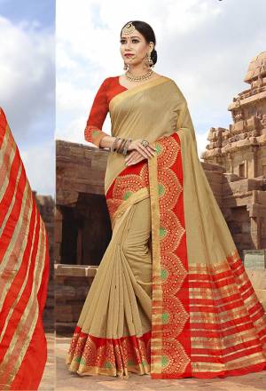Celebrate This Festive Season With Beauty And Comfort Wearing This Saree In Beige Color Paired With Orange Colored Blouse. This Traditional Color Pallete In Cotton Silk Based Saree Will Earn You Lots Of Compliments From Onlookers.
