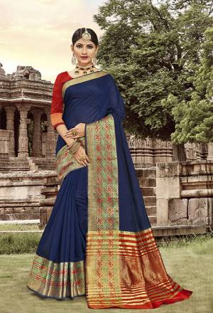 Celebrate This Festive Season With Beauty And Comfort Wearing This Saree In Navy Blue Color Paired With Red Colored Blouse. This Traditional Color Pallete In Cotton Silk Based Saree Will Earn You Lots Of Compliments From Onlookers.