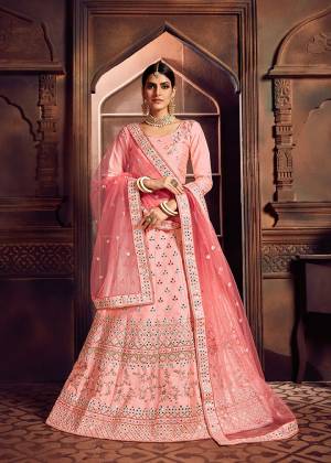 Look Pretty In This Heavy Designer Lehenga Choli In All Over Pink Color. Its Blouse And Lehenga Are Fabricated On Art Silk Paired With Net Fabricated Dupatta. It Is Beautified With Heavy Embroidery Giving It An Attractive Look. 