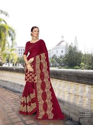 Here Is A Royal Looking Heavy Designer Saree In Maroon Color. This Saree Is Georgette Based Beautified With Heavy Embroidery Paired With art silk Fabricated Blouse. Its Royal Color And Heavy Embroidery Will Earn You Lots Of Compliments From Onlookers. 
