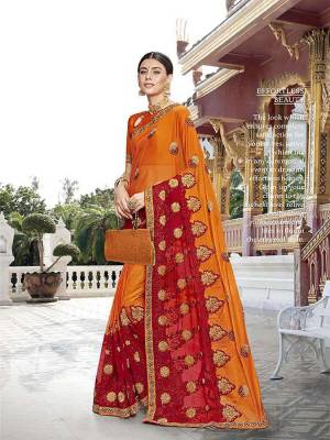 Adorn The Pretty Angelic Look Wearing This Designer Saree In Orange Color Paired With Orange Colored Blouse. This Saree Is Fabricated On Georgette Paired With Art Silk Fabricated Blouse. It Is Beautified With Heavy Embroidery Which Will Earn You Lots Of Compliments From Onlookers. 