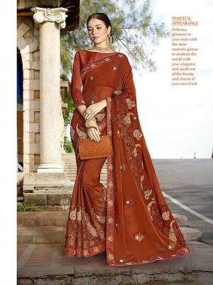 Flaunt Your Rich And Elegant Taste In This Subtle Shade Of Brown Color With This Pretty Designer Saree. This Saree Is Fabricated On Georgette Paired With Art Silk Fabricated Blouse. 
