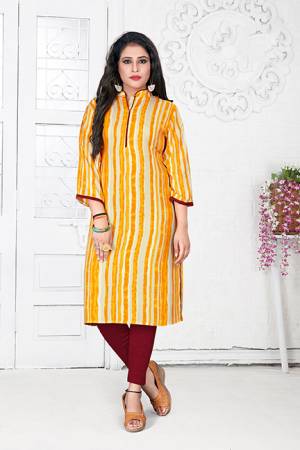 Here Is A Simple Readymade Kurti For Your Casual Wear In Yellow And Cream Color Fabricated On Rayon Beautified With Prints. It Is Light In Weight And Easy To Carry All Day Long.