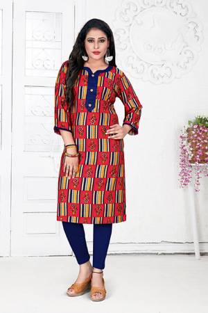 For Your Casual Wear, Grab This Readymade Simple Kurti In Red And Multi Color Fabricated On Rayon. It Is Beautified With Prints All Over.