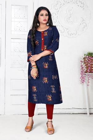 Here Is A Simple Readymade Kurti For Your Casual Wear In Navy Blue Color Fabricated On Rayon Beautified With Prints. It Is Light In Weight And Easy To Carry All Day Long.