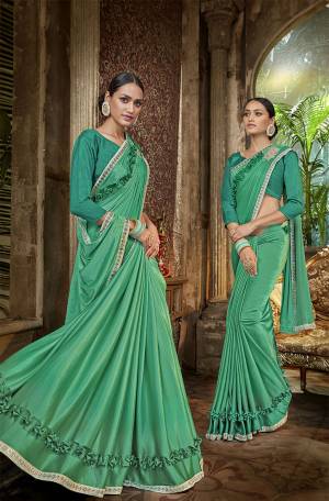 Add This Very Beautiful Designer Saree In Lovely Sea Green Color. This Saree Is fabricated On Lycra Paired With Art Silk Fabricated Blouse. Its Fabric Is Light Weight, Durable And Easy To Carry Throughout The Gala.