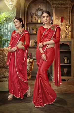 You Will Definitely Earn Lots Of Compliments Wearing This Attractive Looking Designer Saree In Red Color. This Beautiful Saree Is Fabricated On Lycra Paired With Art Silk Fabricated Blouse. Buy This Beautiful Saree Now.