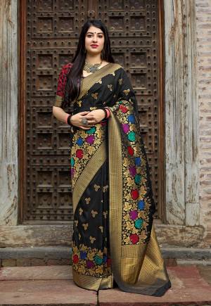 For A Bold And Beautiful Look, Grab This Designer Saree In Black Color Paired With Black & Red Colored Blouse. This Saree And Blouse Are Banarasi Art Silk Based Beautified With Attractive Weave All Over. Buy Now.
