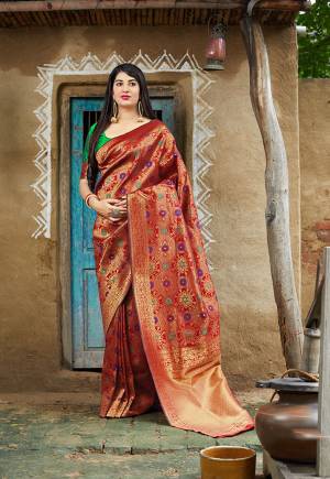 Proper Traditional Looking Designer Silk Based Saree Is Here In Red Color Paired With Contrasting Green Colored Blouse. This Saree And Blouse Are Fabricated On Banarasi Art Silk. Buy Now.