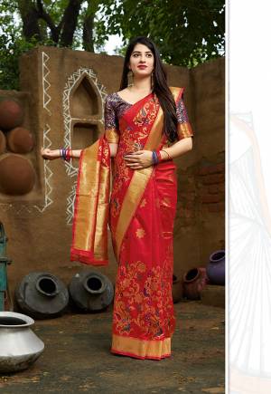Grab This Designer Silk Based Bright Colored Saree In Red Color Paired With Purple Colored Blouse. This Saree And Blouse Are Fabricated On Banarasi Art Silk Beautified With Weave All Over. 