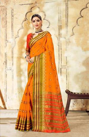 Celebrate This Festive Season With Ease And Comfort Wearing This Royal Looking Silk Based Saree In Musturd Yellow Color Paired With Orange Colored Blouse. This Saree Is Cotton Silk Based Paired With Art Silk Fabricated Blouse. Buy Now.