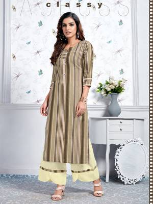 Here Is A Lovely Pair Of Designer Readymade Kurti In Brown Color Paired With Cream Colored Plazzo. This Kurti And Plazzo Are Fabricated On Cotton Beautified With Prints. It Is Light In Weight And Easy To Carry All Day Long. 