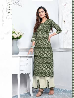 For Your Semi-Casuals, Grab This Designer Kurti And Plazzo In Green And Light Green Color Respectively. This Readymade Pair Is Cotton Based Beautified With Prints. It Is Available In All Regular Sizes. Buy Now.