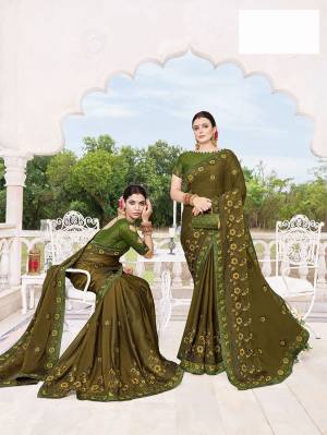 You Will Definitely Earn Lots Of Compliments Wearing This Designer Silk Georgette Based Saree In Dark Olive Green Color. It Is Beautified With Heavy Embroidery Paired With Art Silk fabricated Blouse. 