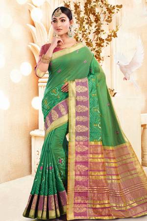 For A Proper Traditional Look, Grab This Designer Saree In Green Color Paired With Contrasting Pink Colored Blouse. This Saree And Blouse Are Silk Based Which Gives A Rich Look To Your Personality