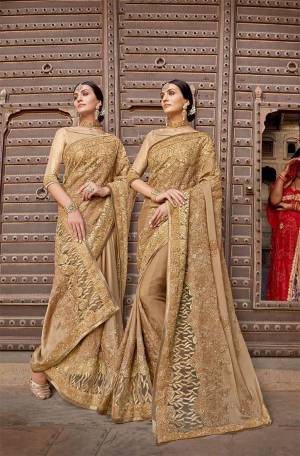 Flaunt Your Rich And Elegant Taste Wearing This Heavy Designer Saree In Beige Color. This Saree Is Fabricated on Silk Georgette Paired With Art Silk Fabricated Blouse. Buy This Lovely Saree Now.