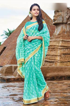 Grab This Simple And Elegant Printed Saree For Your Casuals Or Semi-Casuals In Turquoise Blue Color. This Saree And Blouse Are Fabricated Cotton Chiffon Which Is Light In Weight And Easy To Carry All Day Long. 