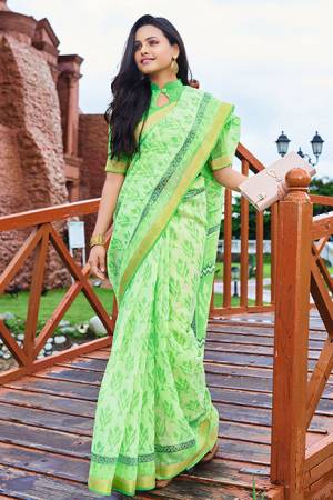 Grab This Simple And Elegant Printed Saree For Your Casuals Or Semi-Casuals In Light Green Color. This Saree And Blouse Are Fabricated Cotton Chiffon Which Is Light In Weight And Easy To Carry All Day Long. 