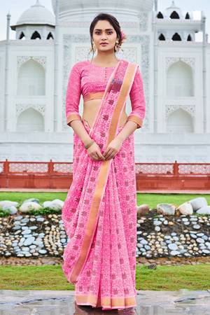 Add This Pretty Saree To Your Wardrobe For Your Semi-Casual Wear, This Lovely Pink Colored Saree And Blouse Are Fabricated Cotton Chiffon. Its Fabric Is Soft Towards Skin And Easy To Carry All Day Long. 