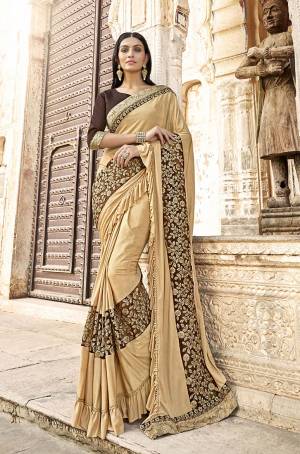 Flaunt Your Rich And Elegant Taste Wearing This Designer Saree In Beige Color Paired with Brown Colored Blouse. This Saree Is Lycra Based Paired With art Silk Fabricated Blouse. Buy Now.