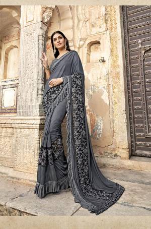 Here Is A Royal Looking Designer Saree In Grey Color. This Saree Is Fabricated On Lycra Paired With Art Silk Fabricated Blouse. It Is Bautified With Hand Work Patch And Fancy Lace Border