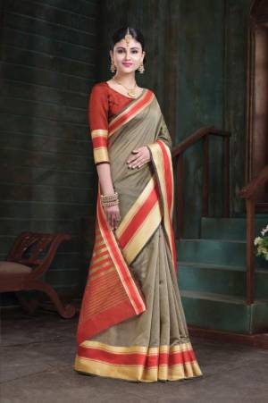 Flaunt Your Rich And Elegant Taste In This Simple Saree In Grey Color Paired With Red Colored Blouse. This Saree And Blouse Are Fabricated On Art Silk Whih Gives A Rich Look To Your Personality. 