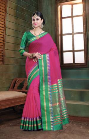 Simple And Elegant Silk Based Saree For Your Casual Or Semi-Casual Wear In Magenta Pink Color Paired With Contrasting Green Colored Blouse. This Saree Is Light In Weight And easy To Carry all Day Long.