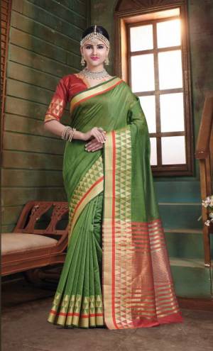 Flaunt Your Rich And Elegant Taste In This Simple Saree In Olive Green Color Paired With Red Colored Blouse. This Saree And Blouse Are Fabricated On Art Silk Whih Gives A Rich Look To Your Personality. 