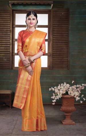 Simple And Elegant Silk Based Saree For Your Casual Or Semi-Casual Wear In Musturd Yellow Color Paired With Contrasting Orange Colored Blouse. This Saree Is Light In Weight And easy To Carry all Day Long.