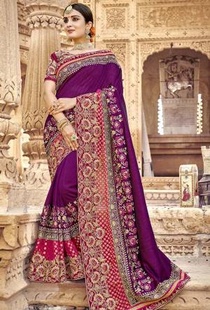 Grab This Heavy Designer Saree In Purple Color Paired With Magenta Pink Colored Blouse. This Saree And Blouse Are Silk based Beautified With Heavy Embroidery Giving It A More Enhanced Look. 