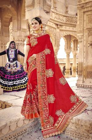 Celebrate This Festive And Wedding Season Wearing This Heavy Designer Saree In Attractive Red Color. This Saree And Blouse Are Rich Silk based With Heavy Embroidery All Over. 