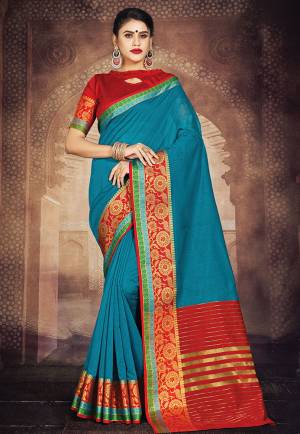 Flaunt Your Rich And Elegant Taste In This Simple Saree In Blue Color Paired With Red Colored Blouse. This Saree And Blouse Are Fabricated On Art Silk Whih Gives A Rich Look To Your Personality. 
