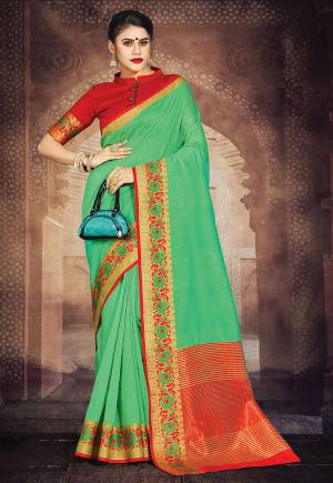 Flaunt Your Rich And Elegant Taste In This Simple Saree In Green Color Paired With Red Colored Blouse. This Saree And Blouse Are Fabricated On Art Silk Whih Gives A Rich Look To Your Personality. 