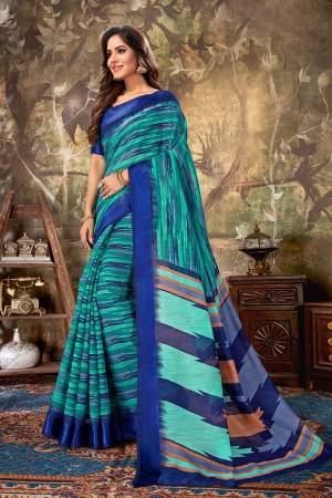 For Your Semi-Casual Wear, Grab This Designer Saree In Blue And Green Color Paired With Royal Blue Colored Blouse. This Saree Is Cotton Based Beautified With Prints Paired With Cotton Silk Fabricated Blouse. 