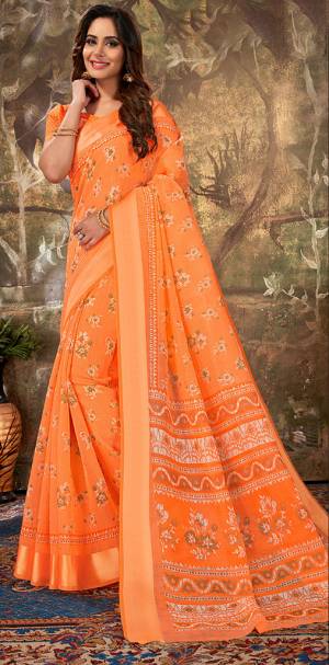 For Your Semi-Casual Wear, Grab This Designer Saree In Orange Color Paired With Orange Colored Blouse. This Saree Is Cotton Based Beautified With Prints Paired With Cotton Silk Fabricated Blouse. 