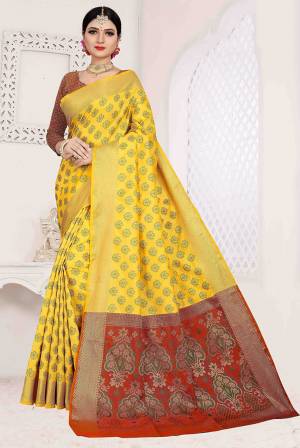 Here Is A Designer Silk Based Saree In Yellow Color Paired With Red Colored Blouse. This Saree And Blouse Are Fabricated On Patola Art Silk Beautified With Weave All Over. It Is Light Weight And Easy To Carry All Day Long. 