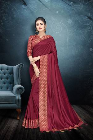Here Is A Rich And Elegant Looking Designer Saree In Magenta Pink Color Paired With Magenta Pink Colored Blouse. This Saree And Blouse Are Silk Based Beautified With Lace Border And Tassels Over The Pallu Border. 