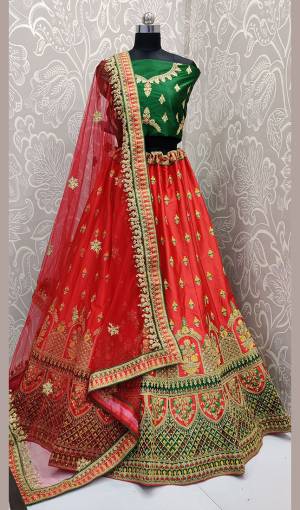 Add This Beautiful Attractive Looking Designer Lehenga Choli In Green Colored Blouse Paired With Red Colored Lehenga And Red Colored Dupatta. This Lehenga Choli Are Fabricated On Satin Silk Paired With Net Fabricated Blouse. It Is Beautified With Heavy Embroidery All Over. Buy Now.