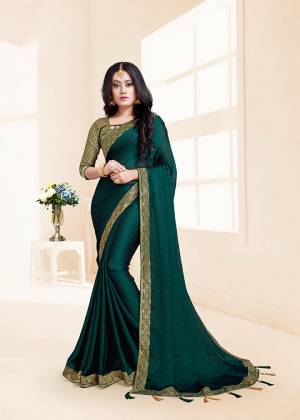 Flaunt Your Rich And Elegant Taste In This Designer Saree In Teal Green Color Paired With Teal Green Colored Blouse. This Silk Based Saree And Rich Color Pallete Will Earn You Lots Of Compliments From Onlookers.