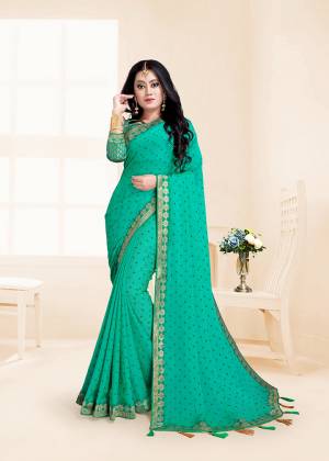 Here Is A Rich And Elegant Looking Designer Saree In Sea Green Color. This Saree Is Fabricated On Chiffon Paired With Jacquard Silk Fabricated Blouse. It Is Beautified With Lace Border And Tassels Over The Pallu Border.