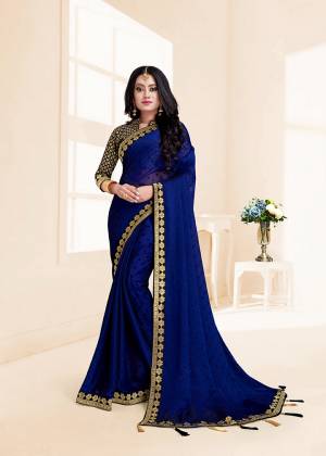 Flaunt Your Rich And Elegant Taste In This Designer Saree In Royal Blue Color. This Chiffon Based Saree Is Paired With Jacquard Silk Fabricated Blouse. Its Rich Color Pallete And Fabric Will Earn You Lots Of Compliments From Onlookers.