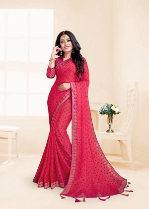 Here Is A Rich And Elegant Looking Designer Saree In Pink Color. This Saree Is Fabricated On Chiffon Paired With Jacquard Silk Fabricated Blouse. It Is Beautified With Lace Border And Tassels Over The Pallu Border.