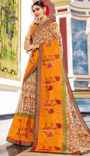 Here Is A Pretty Saree For Your Semi-Casual Wear. This Beautiful Printed Saree Is Fabricated On Super Net Paired With Art Silk Fabricated Blouse. Its Attractive Broad Border Is Beautified With Multi Colored Thread Work. 