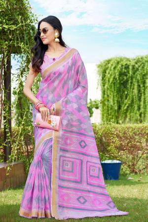 Here Is A Pretty Saree For Your Semi-Casual Wear. This Beautiful?Printed Saree Is Fabricated On Super Net Paired With Cotton Fabricated Blouse. Its Attractive Broad Border Is Beautified With Multi Colored Thread Work.