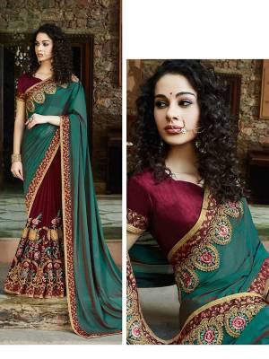 For A Royal And Elegant Look, Here Is The Perfect Heavy Designer Saree For The Same In Teal Green And Maroon Color. This Beautiful Heavy Embroidered Saree Is Fabricated on Satin Silk And Georgette Paired With Art Silk Fabricated Blouse. Buy Now.