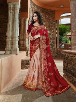 Look Pretty In Lovely Color Pallete Of Red And Baby Pink With This Heavy Designer Saree. This Pretty Saree And Blouse Are Silk Based Which Also Gives A Rich Look To Your Personality. 