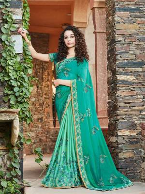 Add This Pretty Saree To Your Wardrobe For The Upcoming Festive And Wedding Season In Sea Green Color. This Saree Is Fabricated On Chiffon and Satin Paired With Art Silk Fabricated Blouse. 