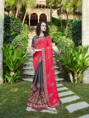 Trendy Color Pallete Is Here With This Heavy Designer Saree In Dark Pink And Grey Color Paired With Grey Colored Blouse. This Saree Is Silk Based Beautified With Heavy Embroidery Work. Buy This Saree Now.